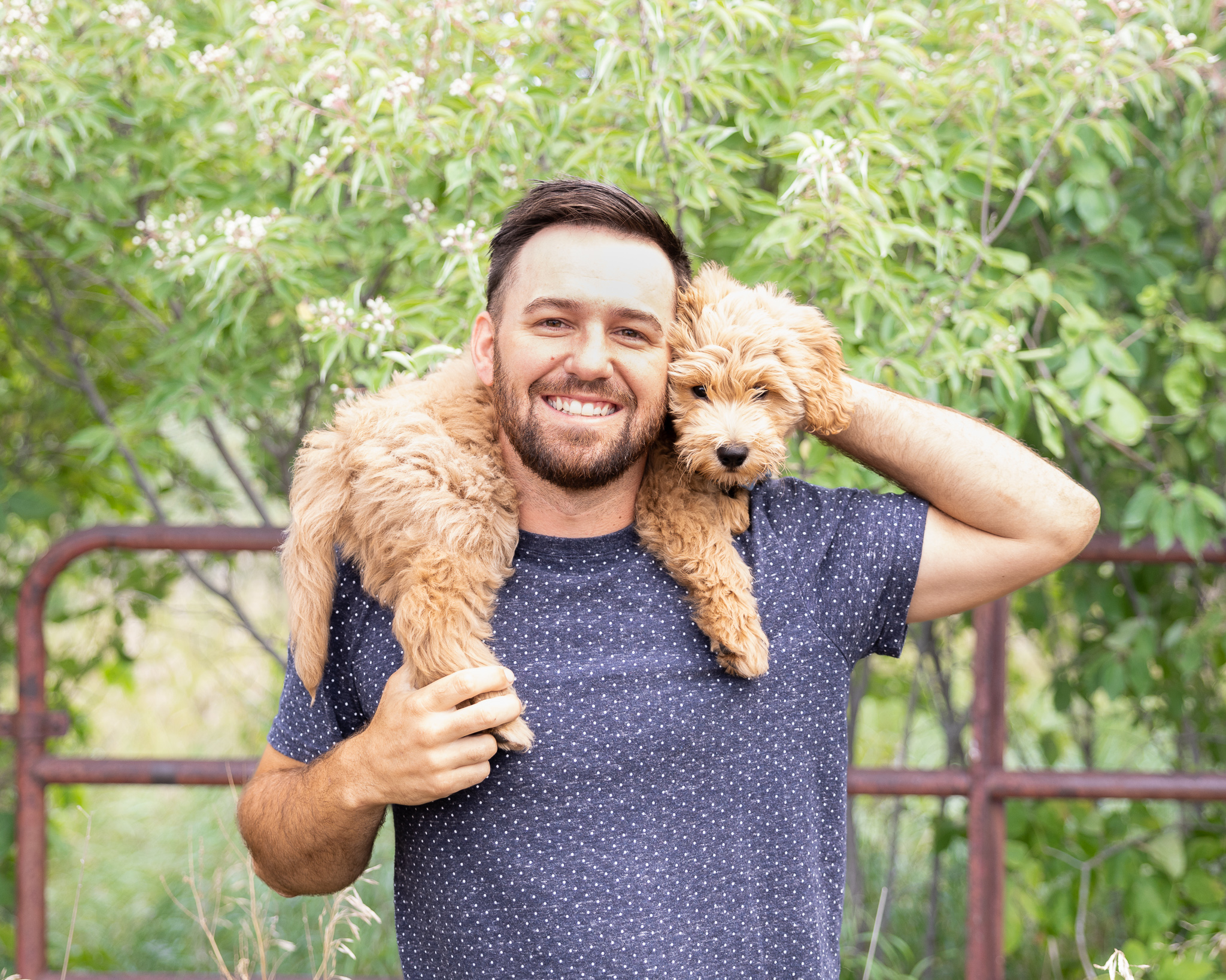 Brandon holding a cute puppy